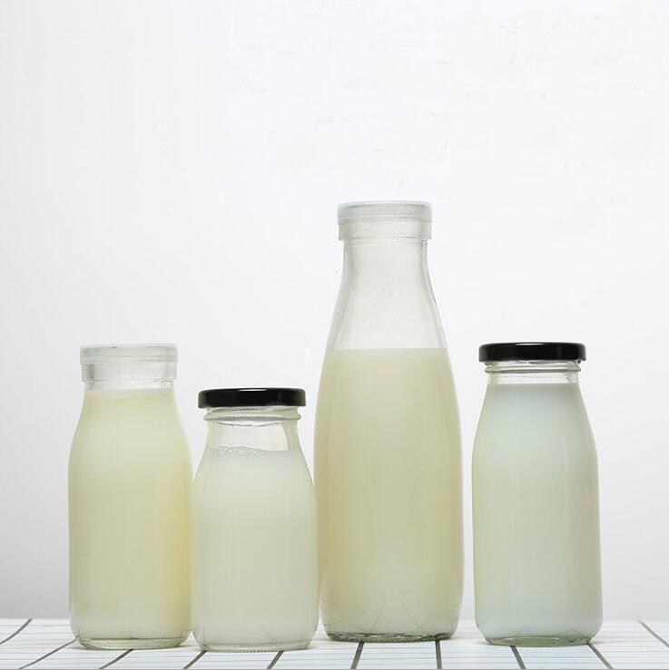 Wholesale 200 ML 250 ML 500 ML 1000 ML clear round milk beverage juice glass bottle with metal lid