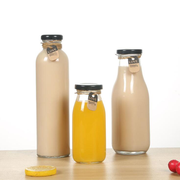 Wholesale 200ml 250ml 300ml beverage bottle juice glass bottle with lid