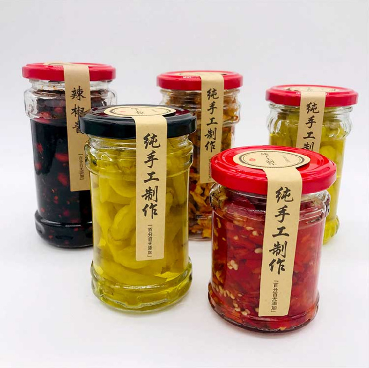 Wholesale 200ml glass jar for pickles food industry empty clear storage jars glass for beef paste ketchup with black metal lids