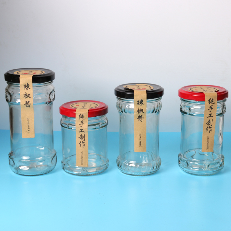 Wholesale 200ml glass jar for pickles food industry empty clear storage jars glass for beef paste ketchup with black metal lids