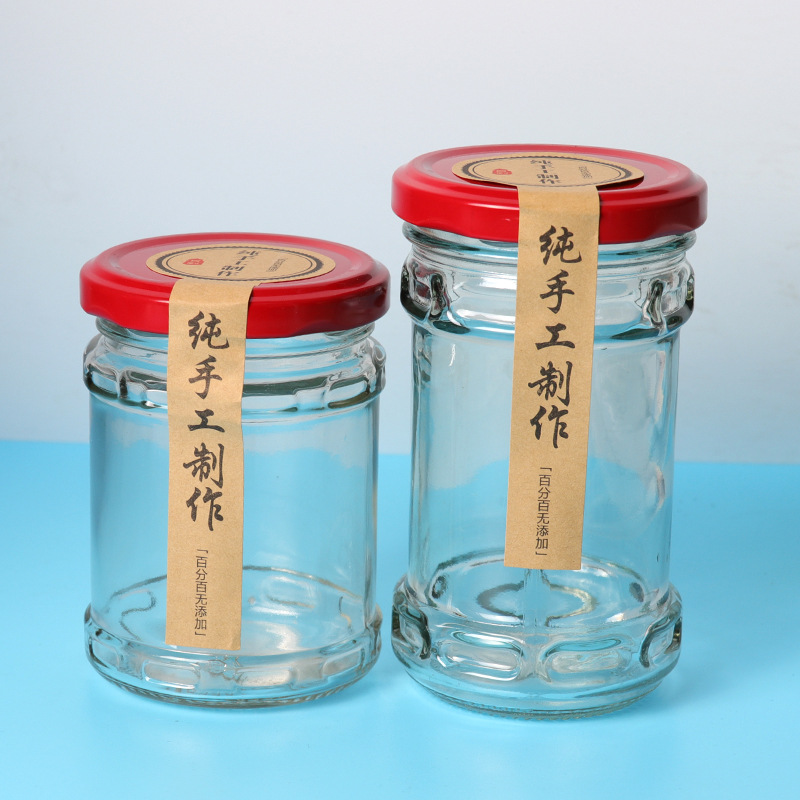 Wholesale 200ml glass jar for pickles food industry empty clear storage jars glass for beef paste ketchup with black metal lids