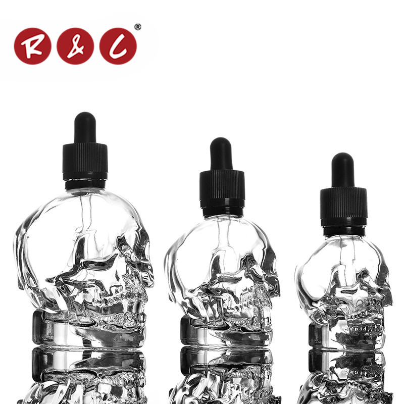 Wholesale 2015 clear skull shape glass bottle with packing box