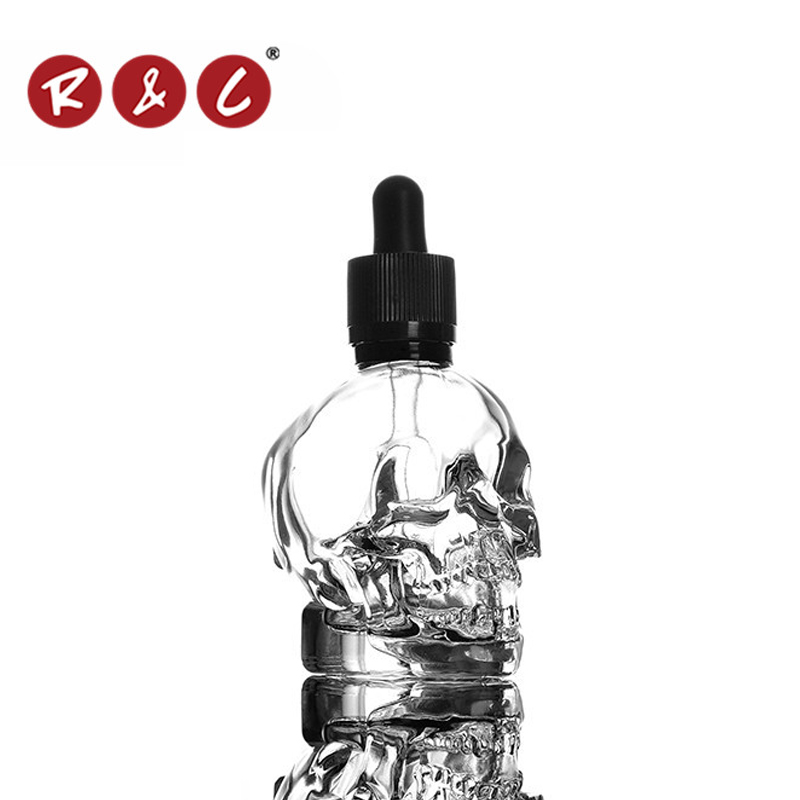 Wholesale 2015 clear skull shape glass bottle with packing box