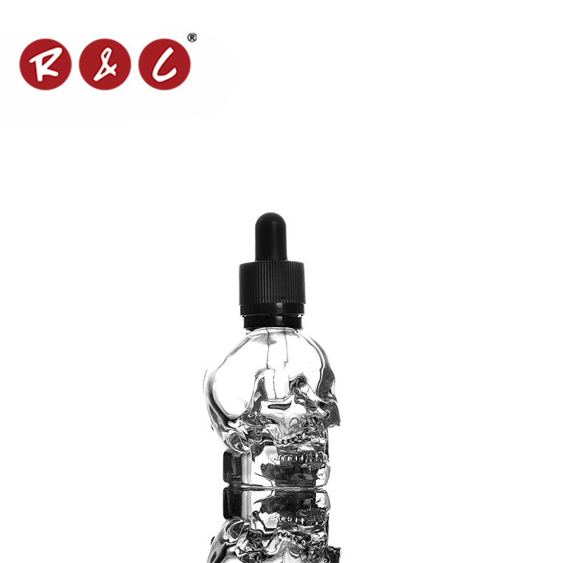 Wholesale 2015 clear skull shape glass bottle with packing box