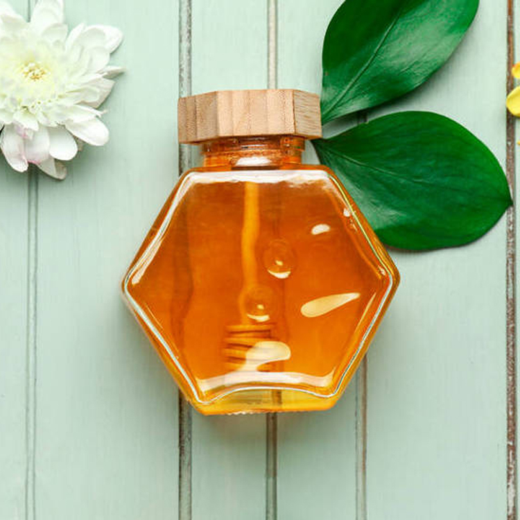 Wholesale 220ml 380ml 250g 500g bamboo cover empty hexagon natural royal honey jar container glass honey jar with dipper