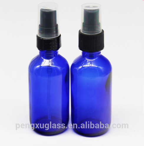 Wholesale 2oz 60ml spray cosmetic bottle cobalt blue boston round glass essential oil bottle with pump sprayer