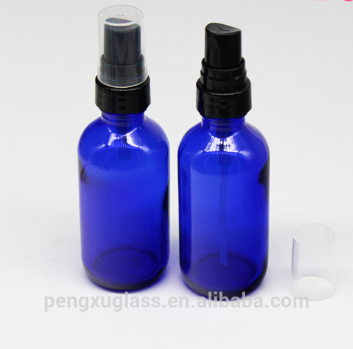 Wholesale 2oz 60ml spray cosmetic bottle cobalt blue boston round glass essential oil bottle with pump sprayer