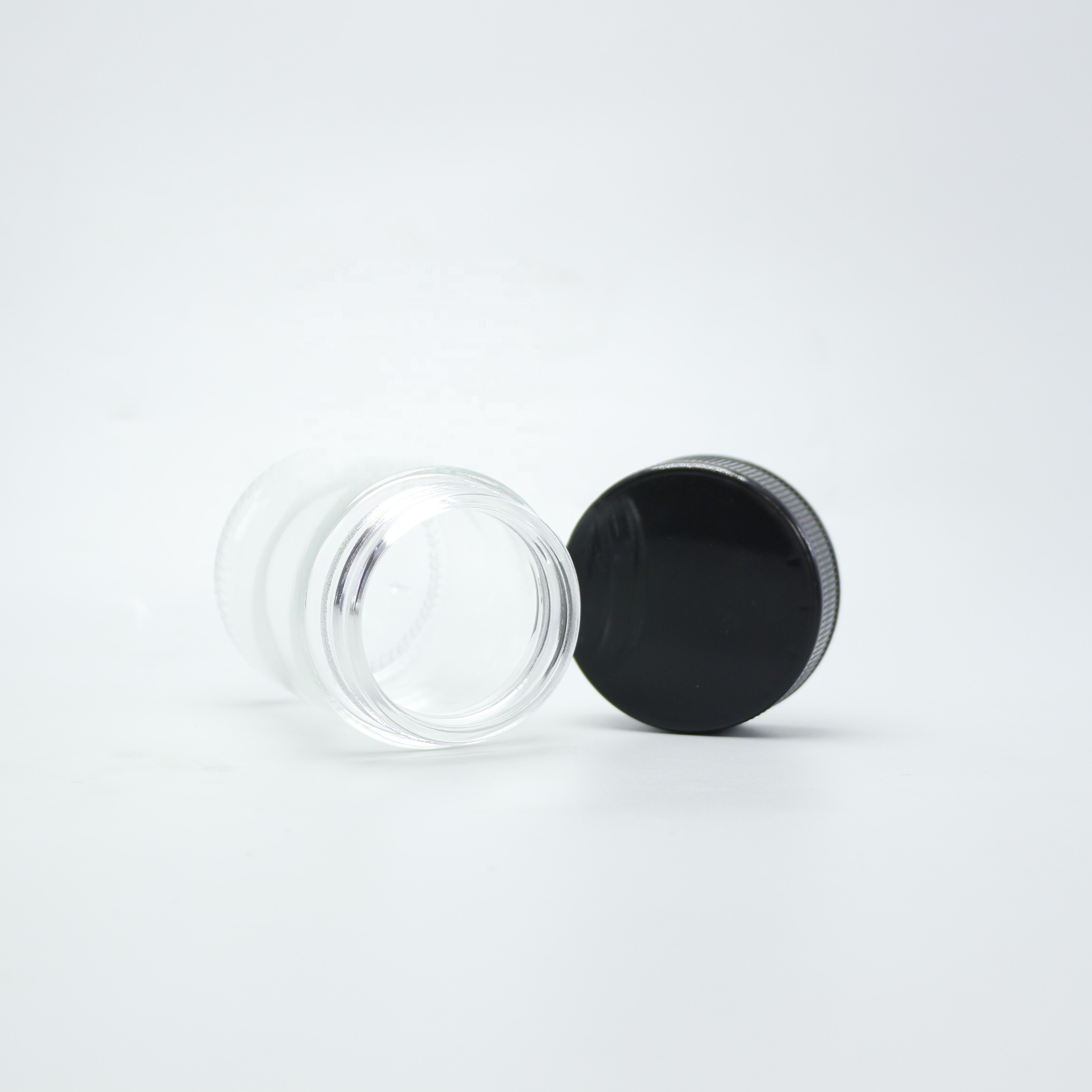 Wholesale 30g 50g 85g 110g child proof glass jar container with childproof cap CGJ-2T