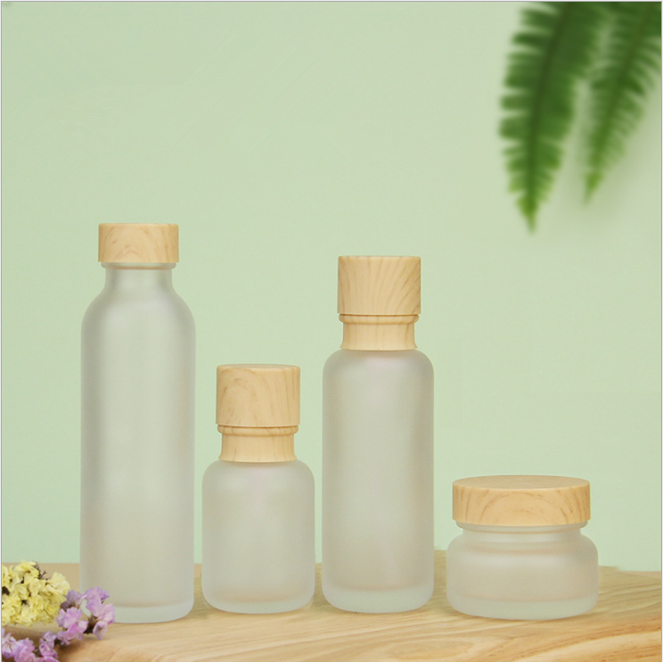 Wholesale 30ml 40ml 60ml toner glass bottle 1oz cosmetic cream jar face spray lotion bottle with bamboo screw cap