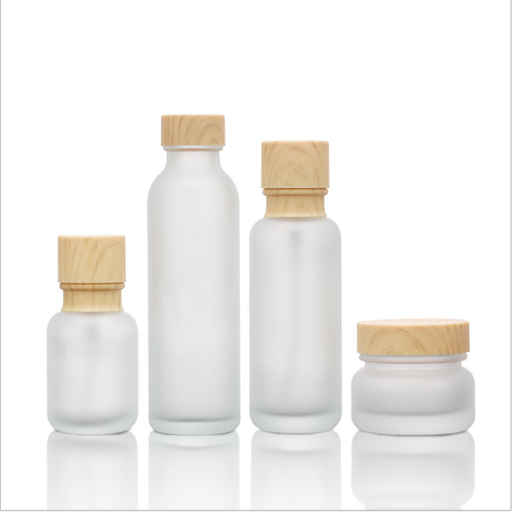 Wholesale 30ml 40ml 60ml toner glass bottle 1oz cosmetic cream jar face spray lotion bottle with bamboo screw cap