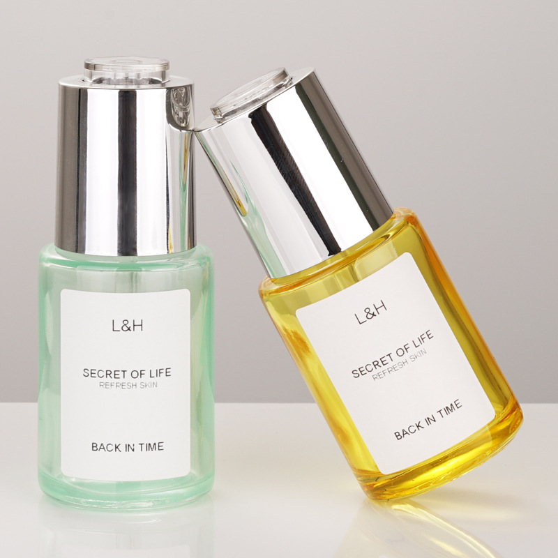 Wholesale 30ml luxurious glass rotary switch press dropper essence oil  bottles