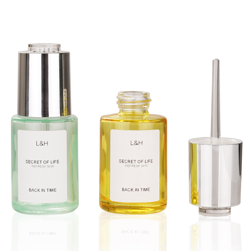 Wholesale 30ml luxurious glass rotary switch press dropper essence oil bottles