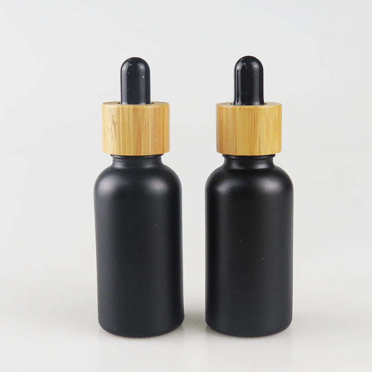 Wholesale 30ml matte frosted black essential oil glass bottle with bamboo dropper cap