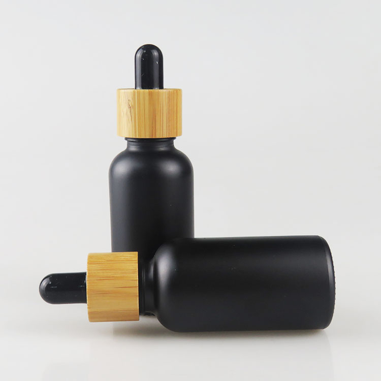 Wholesale 30ml matte frosted black essential oil glass bottle with bamboo dropper cap