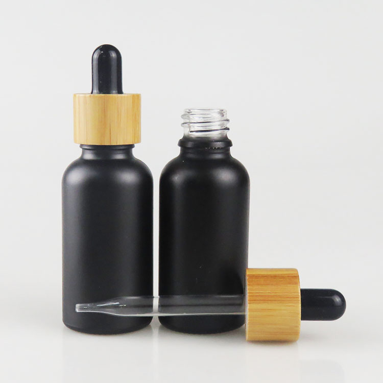 Wholesale 30ml matte frosted black essential oil glass bottle with bamboo dropper cap