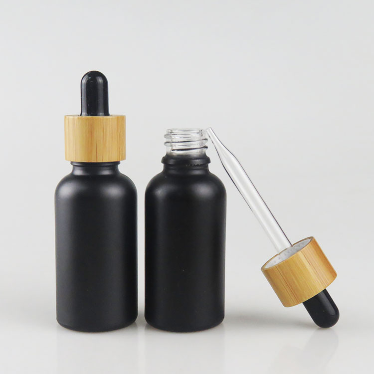 Wholesale 30ml matte frosted black essential oil glass bottle with bamboo dropper cap