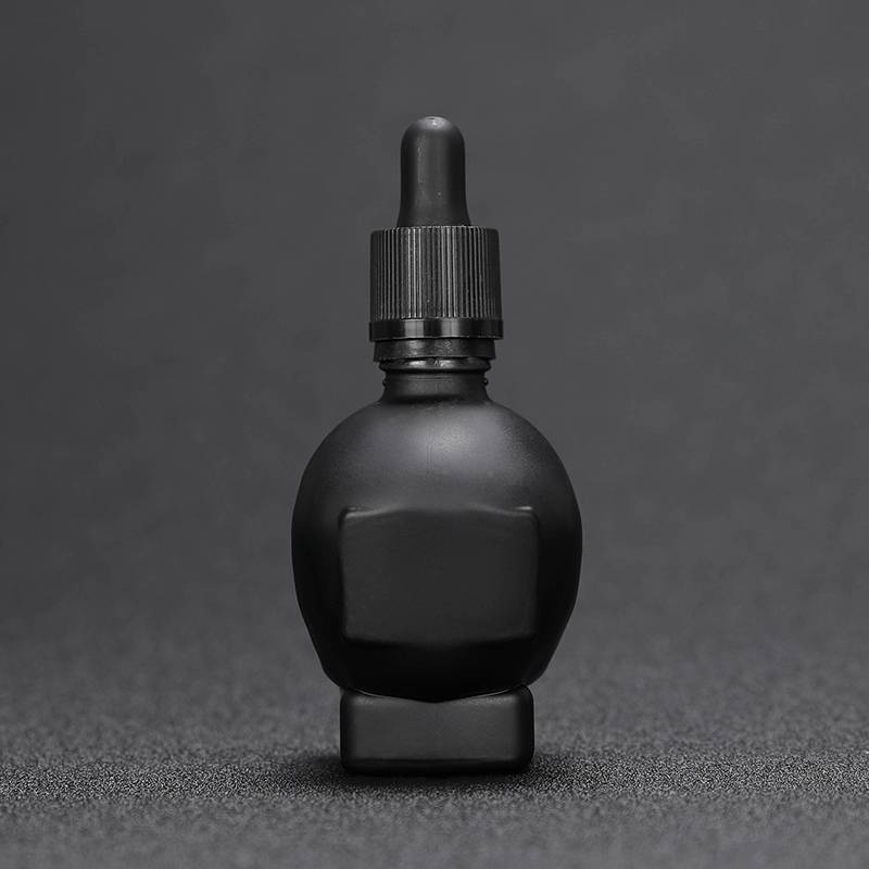 Wholesale 30ml skull shape glass dropper bottle for e juice with child proof dropper 30ml 60ml