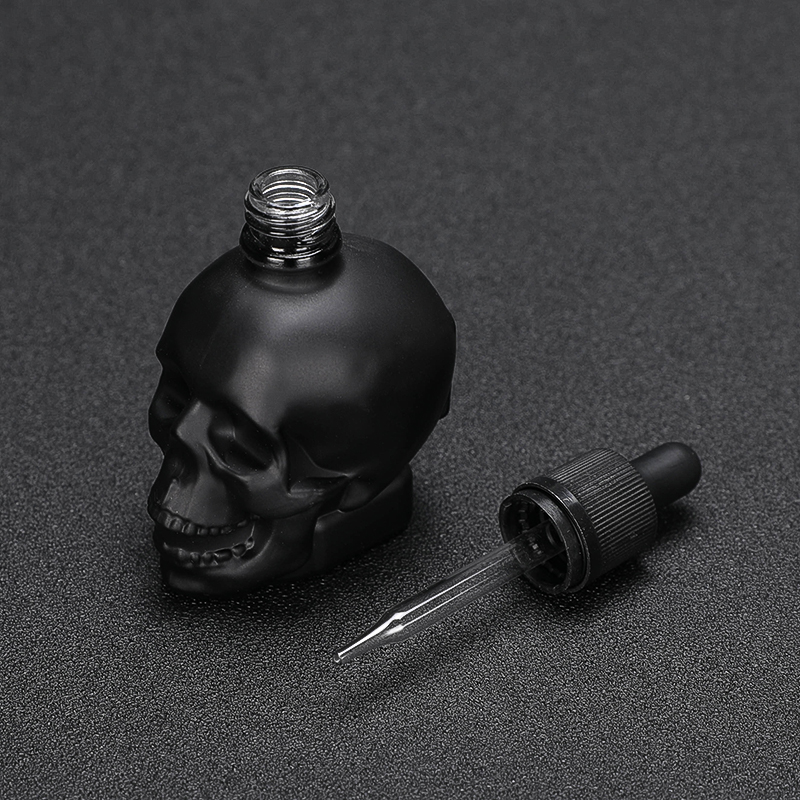 Wholesale 30ml skull shape glass dropper bottle for e juice with child proof dropper 30ml 60ml