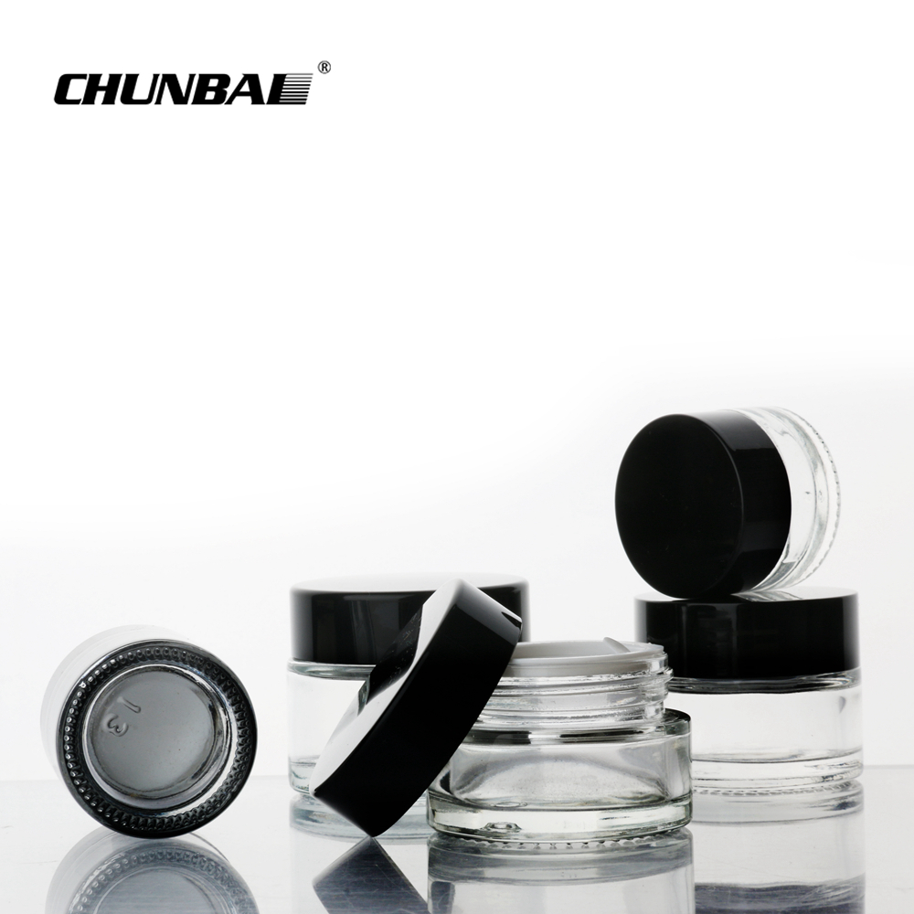 Wholesale 3g 5g small round glass bottle jars childproof glass jar food grade glass jars