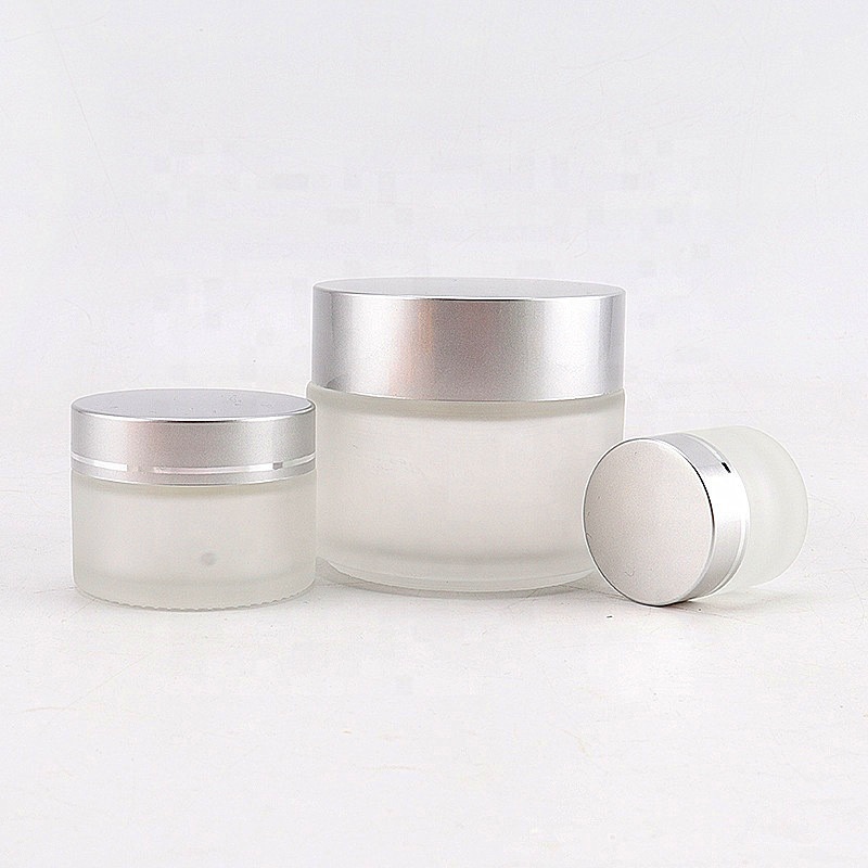 Wholesale 50 g frosted glass cosmetic jar with sliver cap 1 oz glass jar