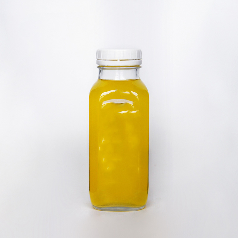 Wholesale 500ml  Empty Carbonated Beverage Cold Pressing Juice Milk Tea Glass Bottles With  Tamper Evident Lid