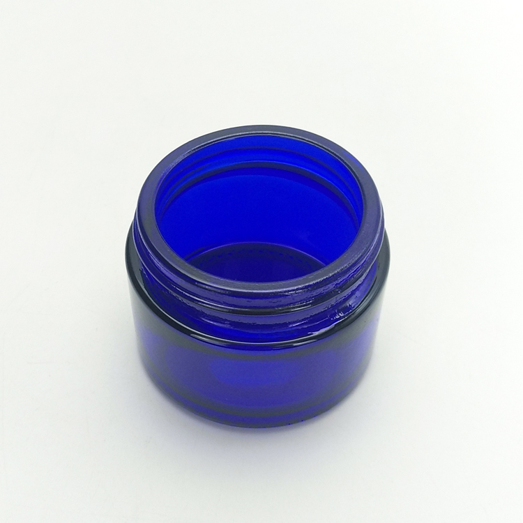 Wholesale 50g blue color empty glass cosmetic jar with plastic lid and gasket