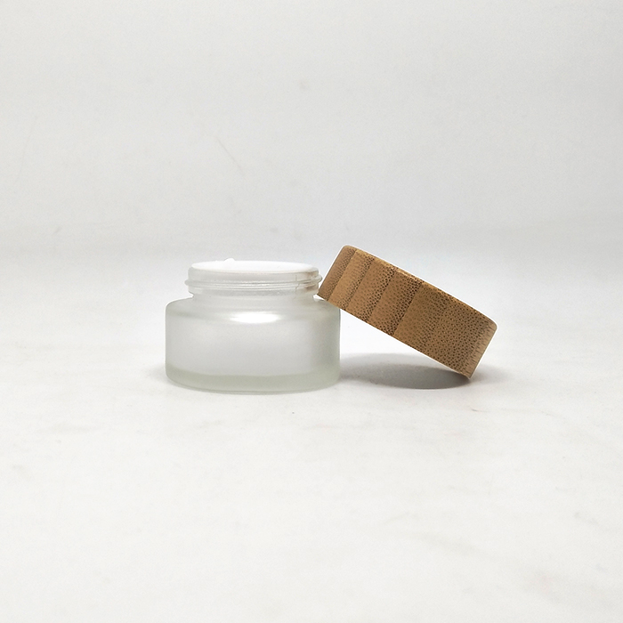 Wholesale 50g round clear frosted glass jar with bamboo top