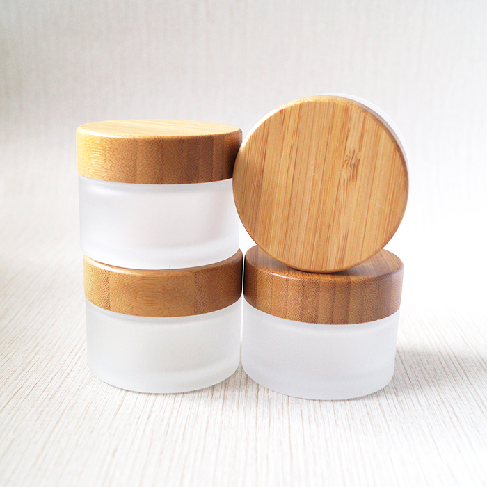 Wholesale 50g round clear frosted glass jar with bamboo top