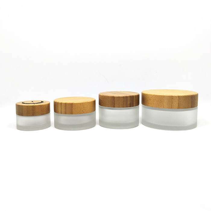 Wholesale 50g round clear frosted glass jar with bamboo top