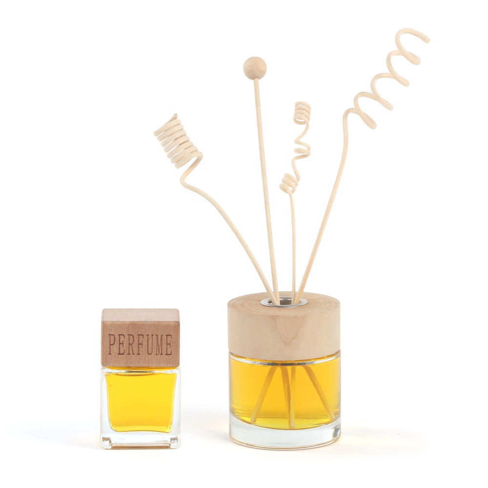 Wholesale 50ml 100ml 200ml round arometic glass diffuser glass bottle with wooden cap