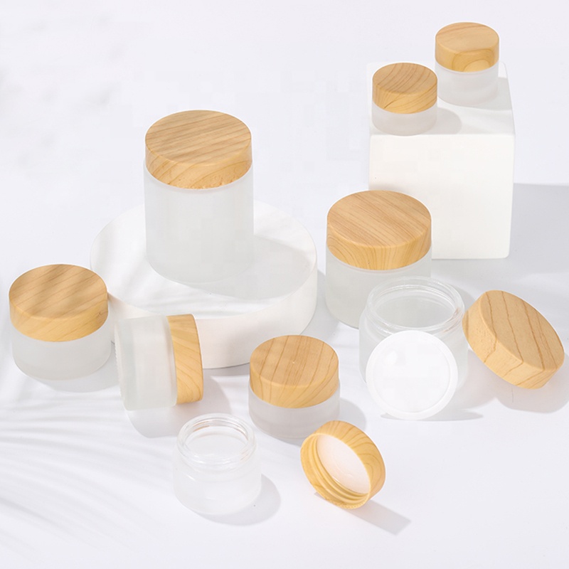 Wholesale 50ml clear frost glass jar cosmetics packaging bamboo lid face cream container glass cream jar with bamboo cap