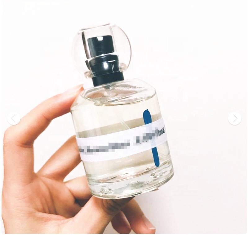 Wholesale 50ml  round Sprayer empty  glass perfume bottle with  round cap