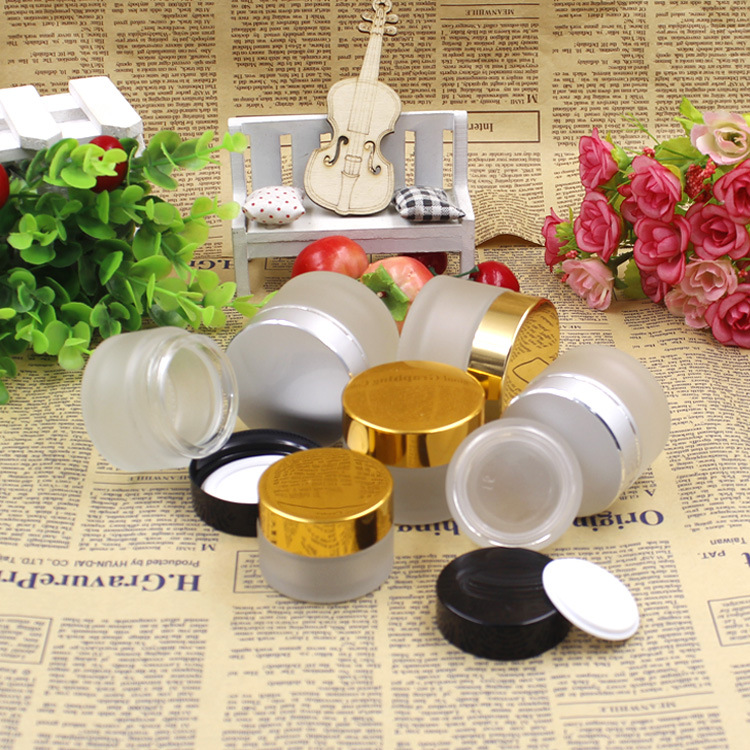 Wholesale 5g 10g 15g 20g 30g 50g 100g frosted clear glass cream jars empty glass bottles for cosmetic cream with aluminum lids
