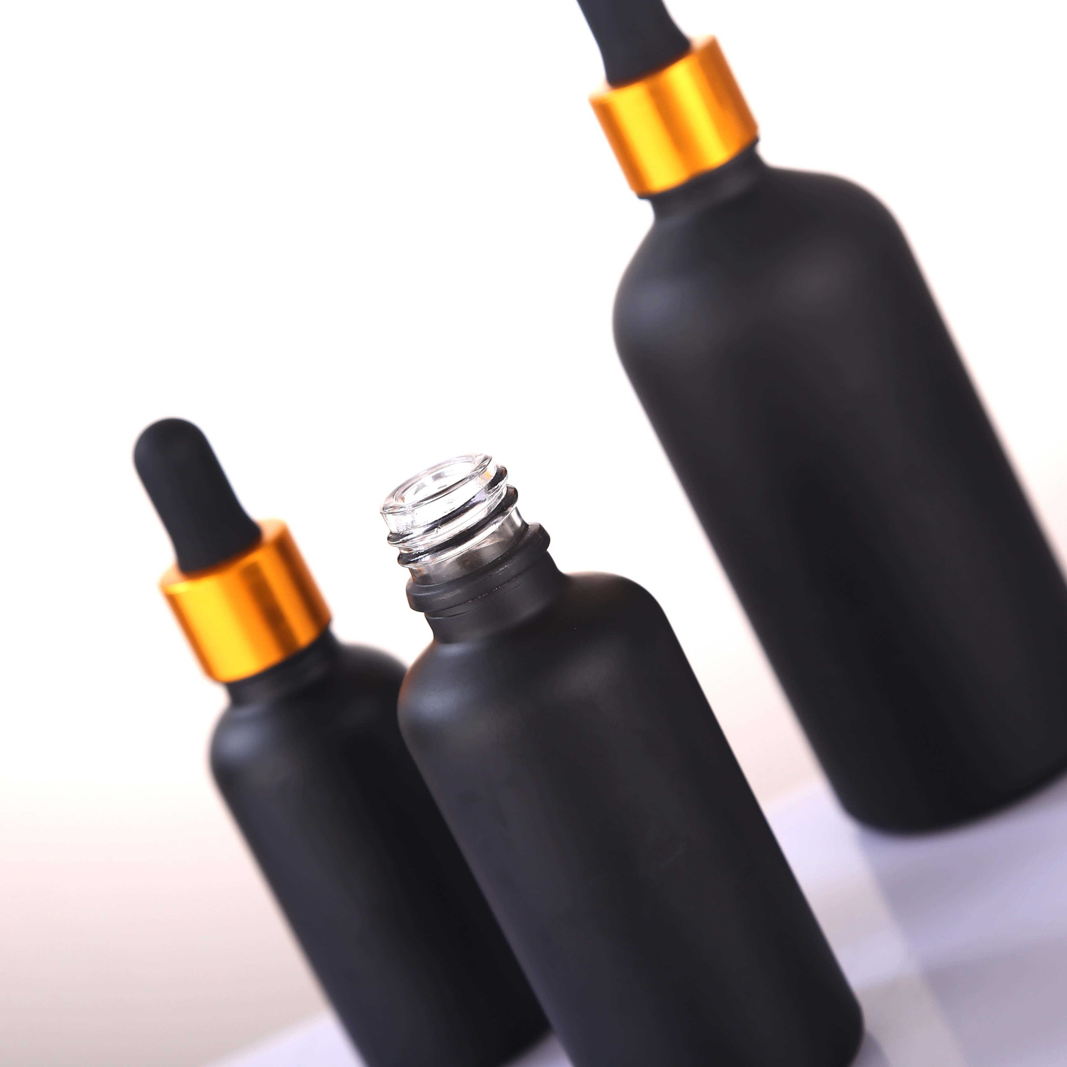 Wholesale 5ml 10ml 15ml 20ml 30ml 50ml 100ml matte black perfume dropper glass bottles with aluminum cap for essential oil