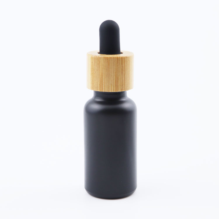 Wholesale 5ml 10ml 20ml 30ml 50ml 100ml Empty Fancy Black Essential Oil Serum Glass Dropper Bottle with bamboo lid