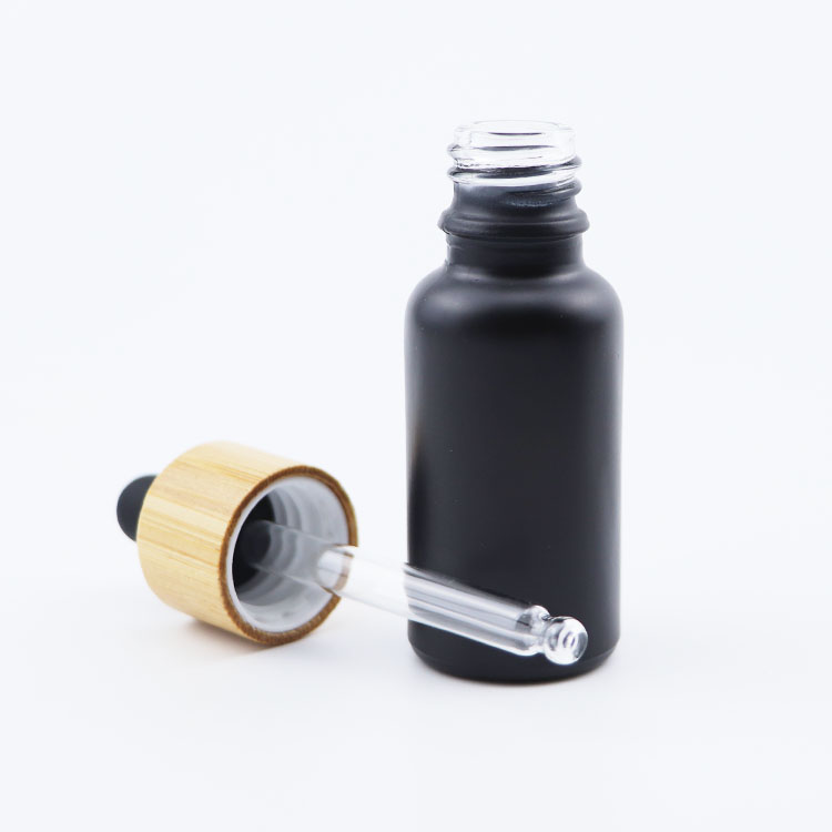 Wholesale 5ml 10ml 20ml 30ml 50ml 100ml Empty Fancy Black Essential Oil Serum Glass Dropper Bottle with bamboo lid