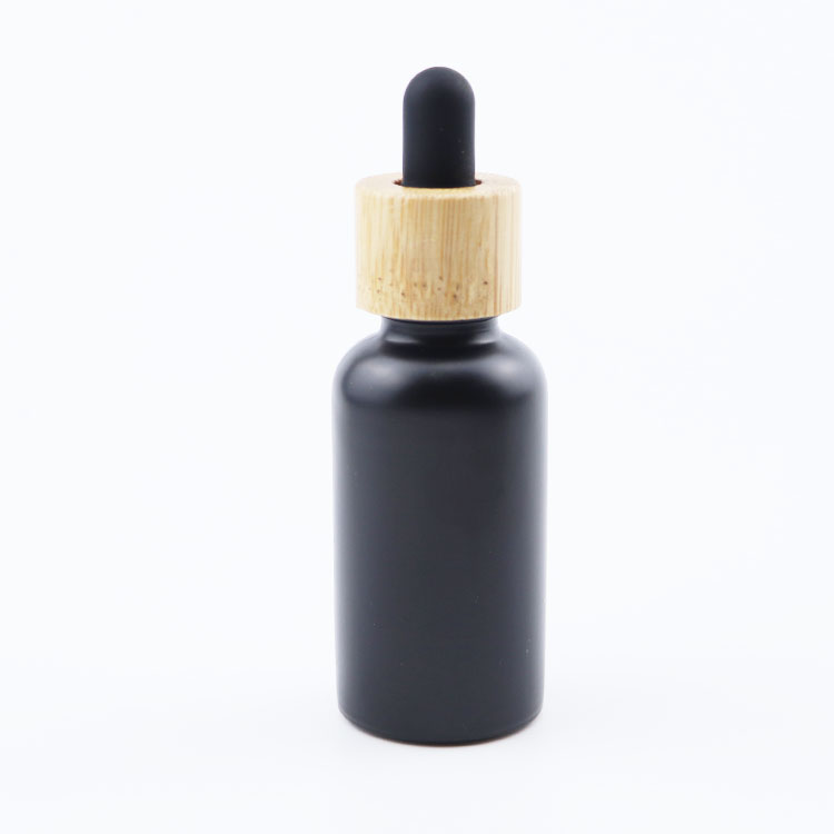 Wholesale 5ml 10ml 20ml 30ml 50ml 100ml Empty Fancy Black Essential Oil Serum Glass Dropper Bottle with bamboo lid