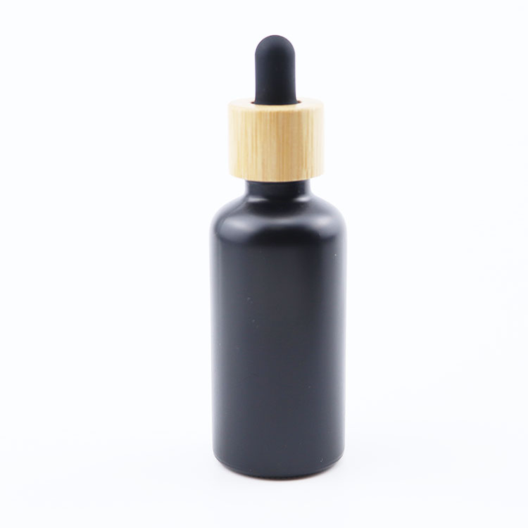 Wholesale 5ml 10ml 20ml 30ml 50ml 100ml Empty Fancy Black Essential Oil Serum Glass Dropper Bottle with bamboo lid