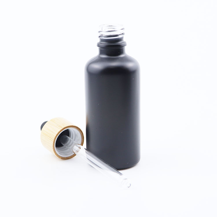 Wholesale 5ml 10ml 20ml 30ml 50ml 100ml Empty Fancy Black Essential Oil Serum Glass Dropper Bottle with bamboo lid
