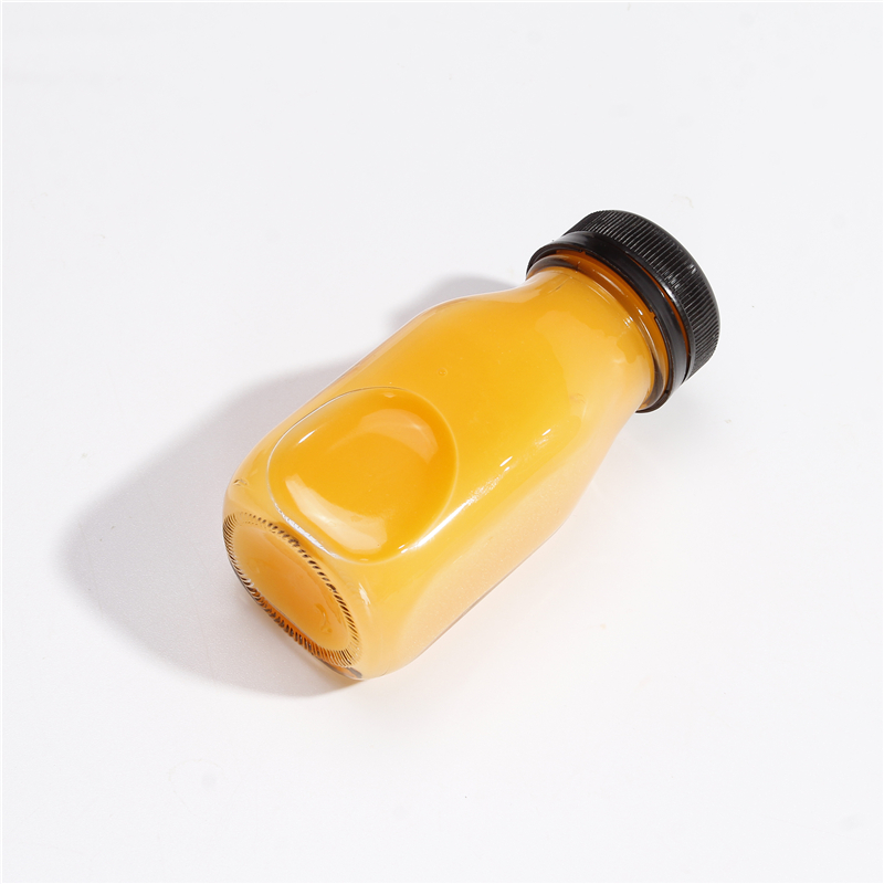 Wholesale 60 ML 2 OZ Juice Glass Beverage Bottle For Milk Juice With Tamper Evident Plastic Lids