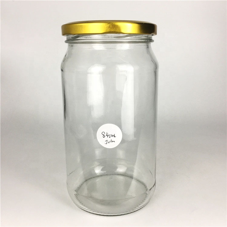 Wholesale 840ml empty round glass food storage jar for jam honey pickles jar with lid