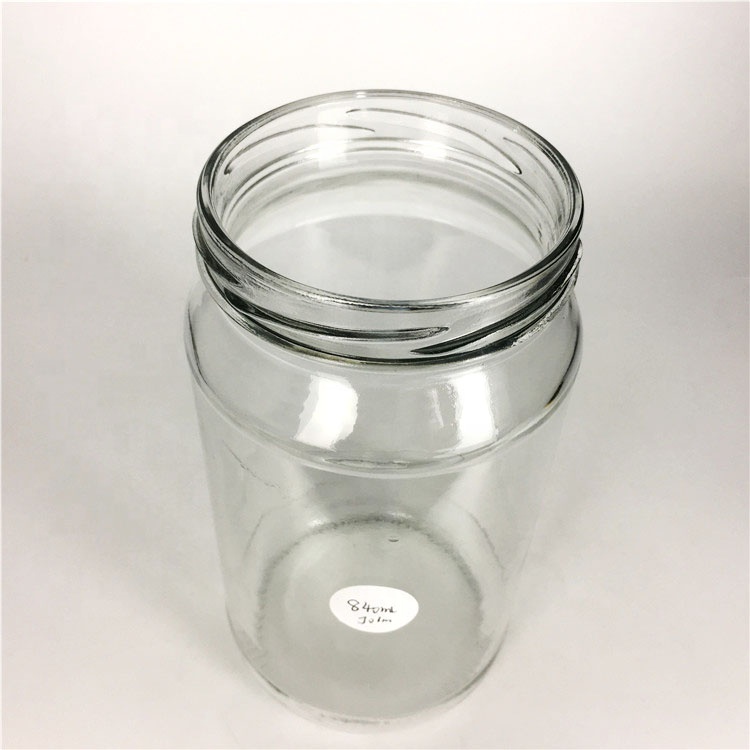 Wholesale 840ml empty round glass food storage jar for jam honey pickles jar with lid