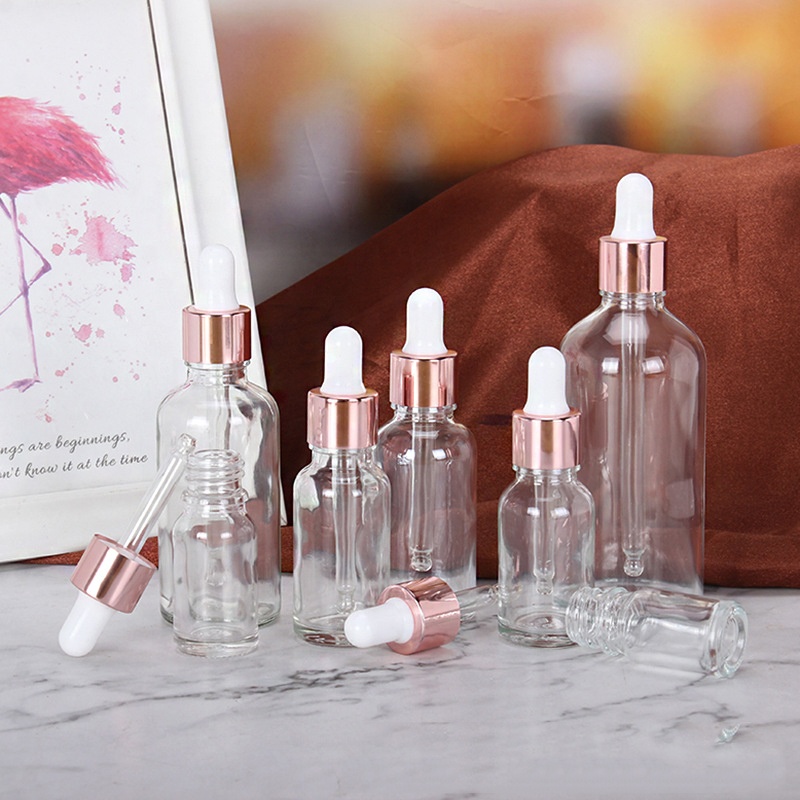 Wholesale Cheap Cosmetic Rose Gold Empty Essential Oil Clear Glass Bottles 15ml 20ml 30ml 50ml Face Serum Frosted Dropper Bottle