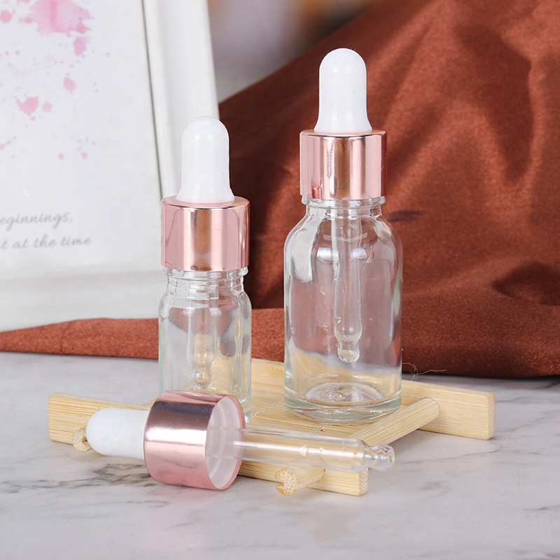 Wholesale Cheap Cosmetic Rose Gold Empty Essential Oil Clear Glass Bottles 15ml 20ml 30ml 50ml Face Serum Frosted Dropper Bottle