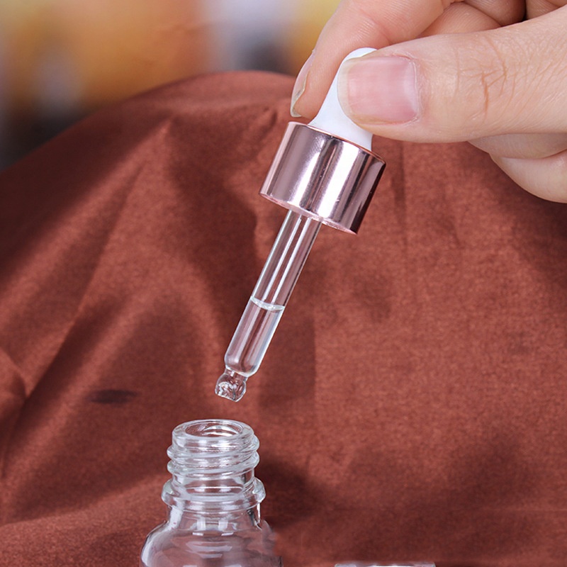Wholesale Cheap Cosmetic Rose Gold Empty Essential Oil Clear Glass Bottles 15ml 20ml 30ml 50ml Face Serum Frosted Dropper Bottle