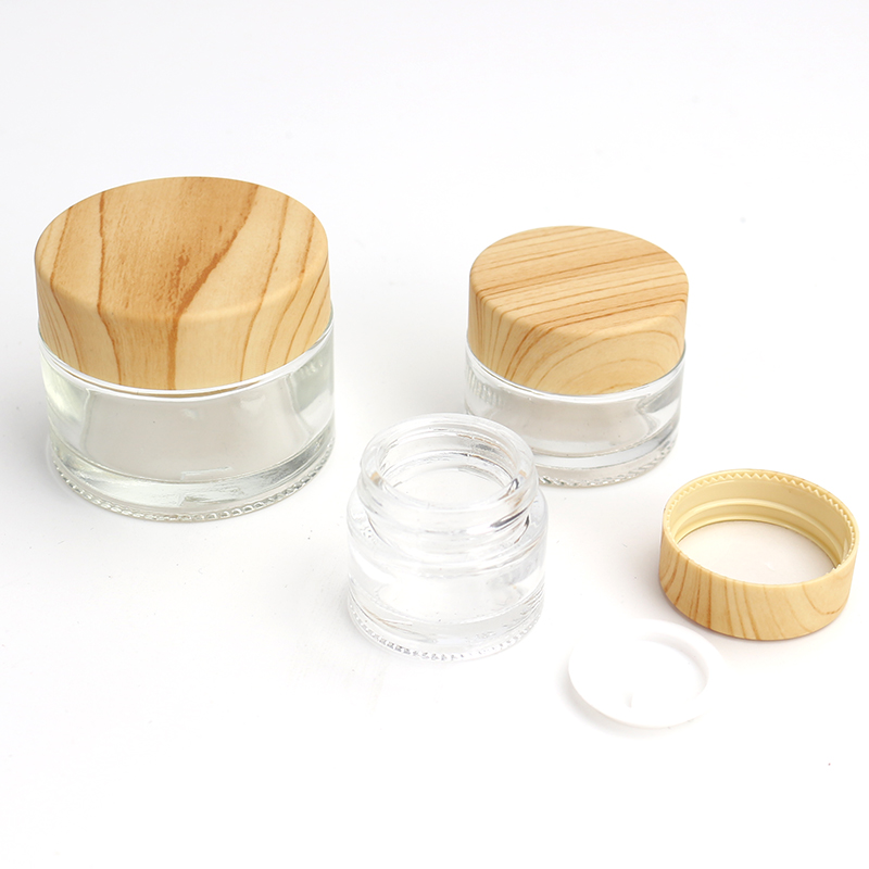 Wholesale Cosmetic 1oz 2oz clear frosted glass jar bamboo wood grain plastic lid with plastic inner