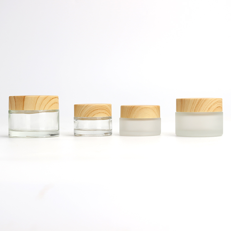 Wholesale Cosmetic 1oz 2oz clear frosted glass jar bamboo wood grain plastic lid with plastic inner