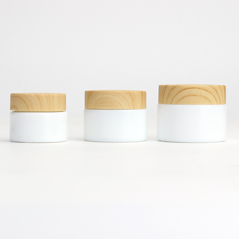 Wholesale Cosmetic 1oz 2oz white glass jar bamboo wood grain plastic lid with plastic inner