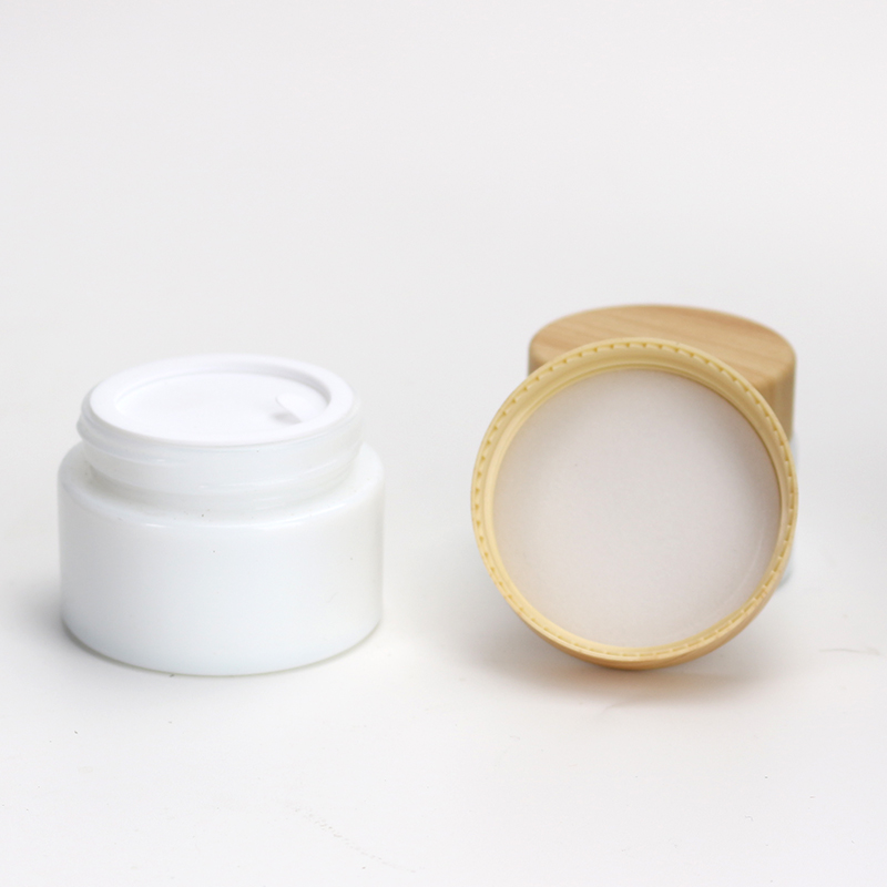 Wholesale Cosmetic 1oz 2oz white glass jar bamboo wood grain plastic lid with plastic inner