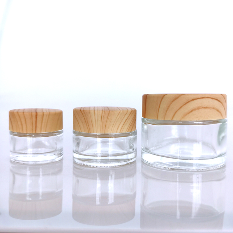 Wholesale Cosmetic 5g 10g 15g 20g 30g 50g 60g 100g clear frosted glass jar wood bamboo grain plastic cover with plastic inner